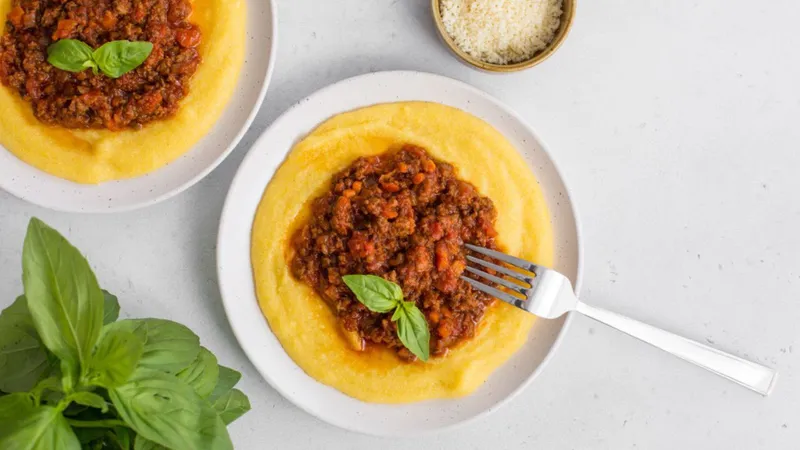 Minced beef in a rich sauce with creamy polenta