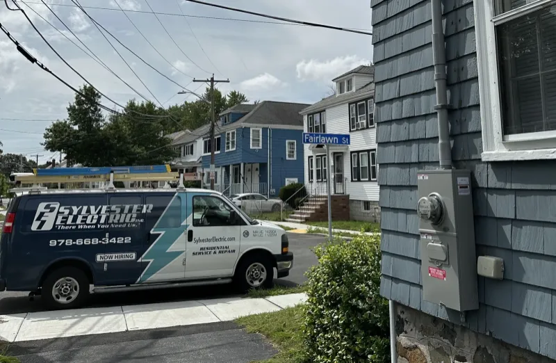Sylvester Electric van beside residential exterior electrical service equipment