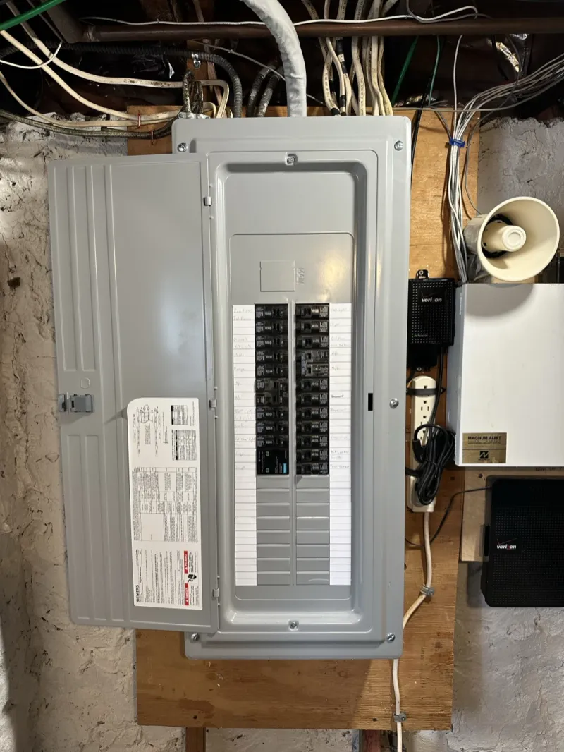 Installed electrical breaker panel with its cover open
