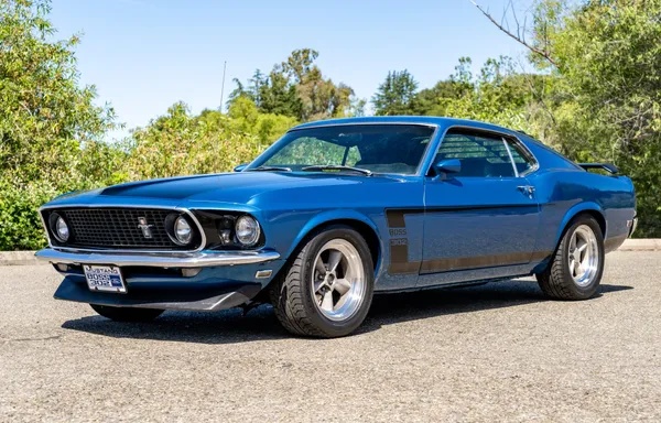 Chassis: 1969 Ford Mustang Fastback platform.  Color: Acutus Blue Metallic with the signature matte black "Boss 302" hockey-sti