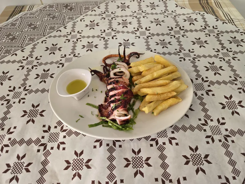Fresh whole kalamari on the grill