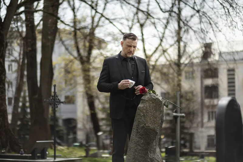 Emotional Marketing - Create an evocative image capturing a solitary man standing before a crowd of people from various walks of life, each with a candle in hand. The setti