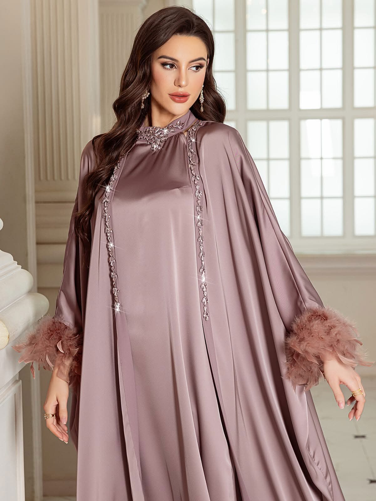 A luxe satin embellished feather dress with a matching kaftan