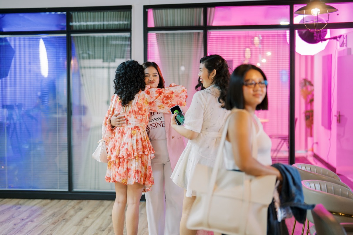 Two FWIB members hugging hello at the Mini Meetup