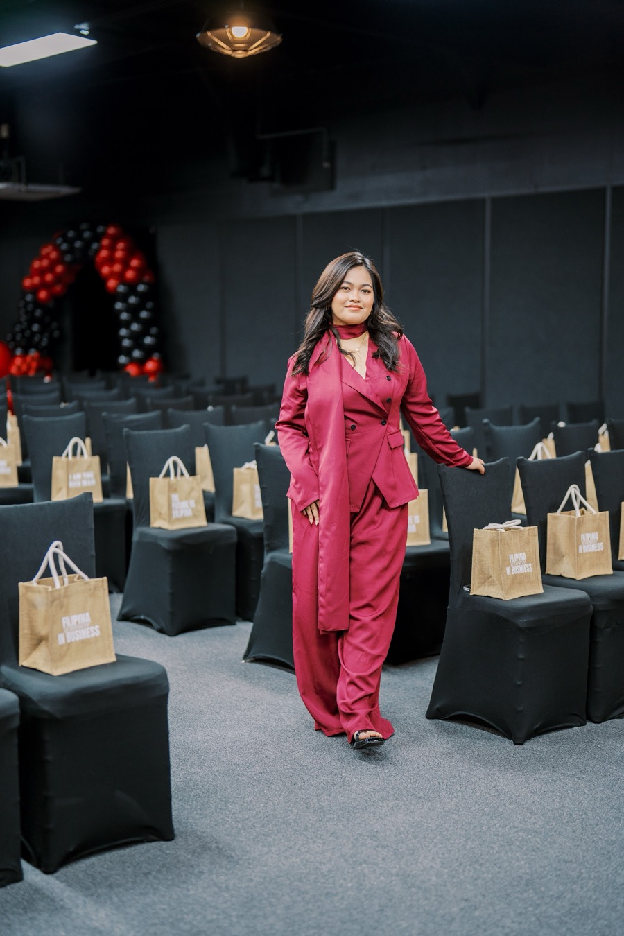 The Year End Party room with a tote on every seat