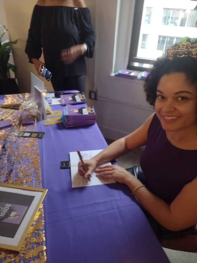 Dr. Onaysia Martinez signing copies of Born Bold