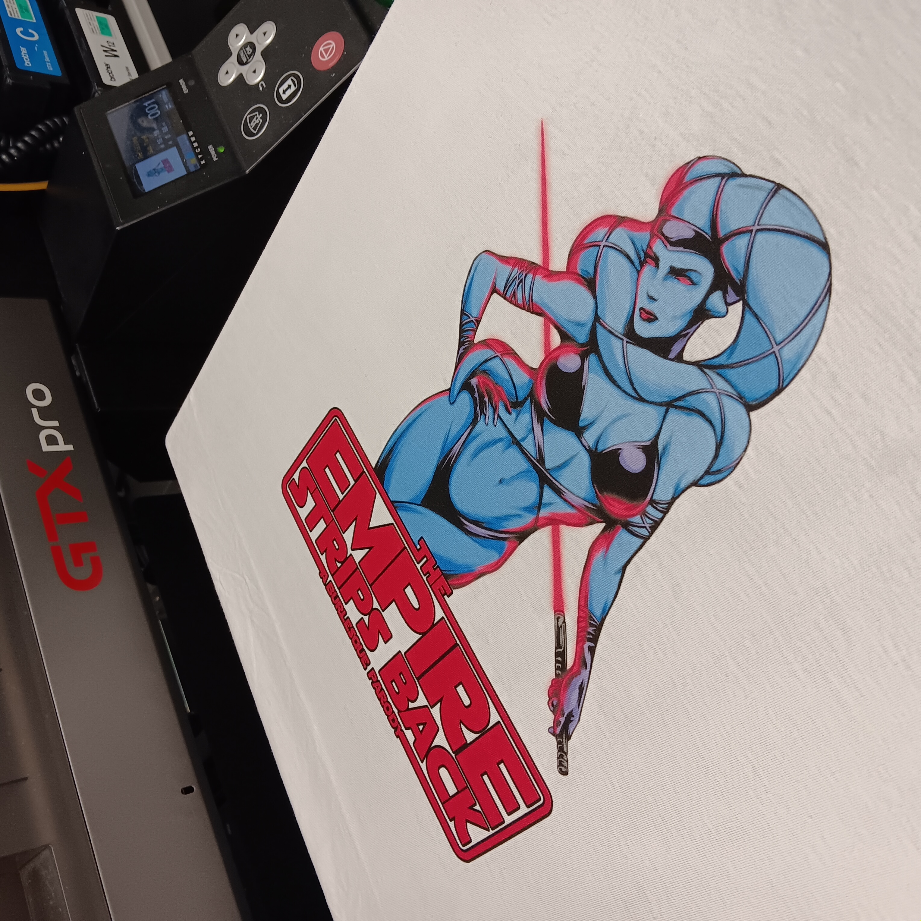 A graphic shirt on a direct-to-garment printer
