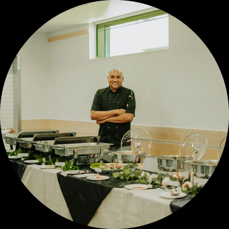 A Walkway to Ceylon chef standing beside a set catering buffet