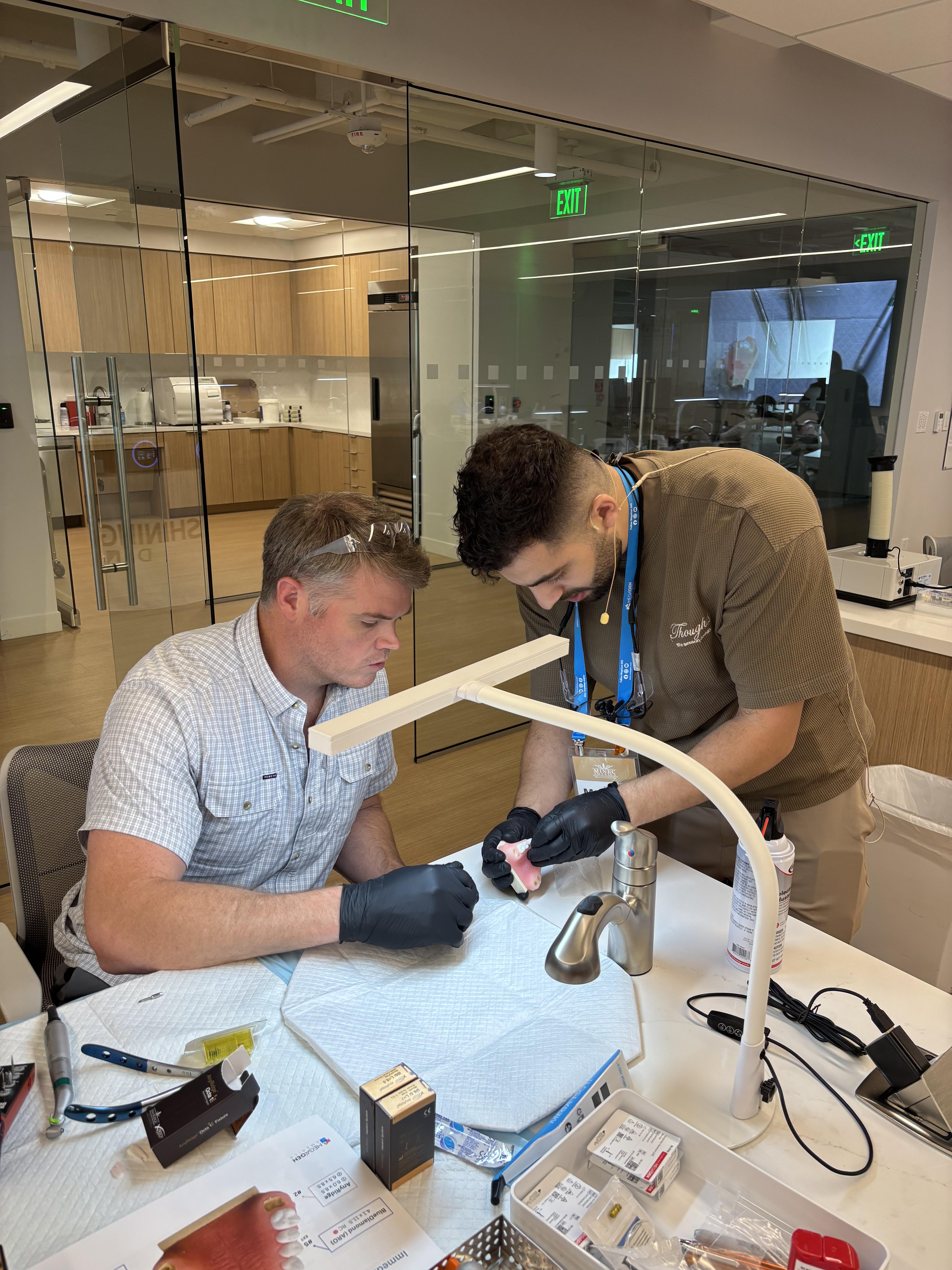 Dr. Faraj teaching implant technique to practicing dentists