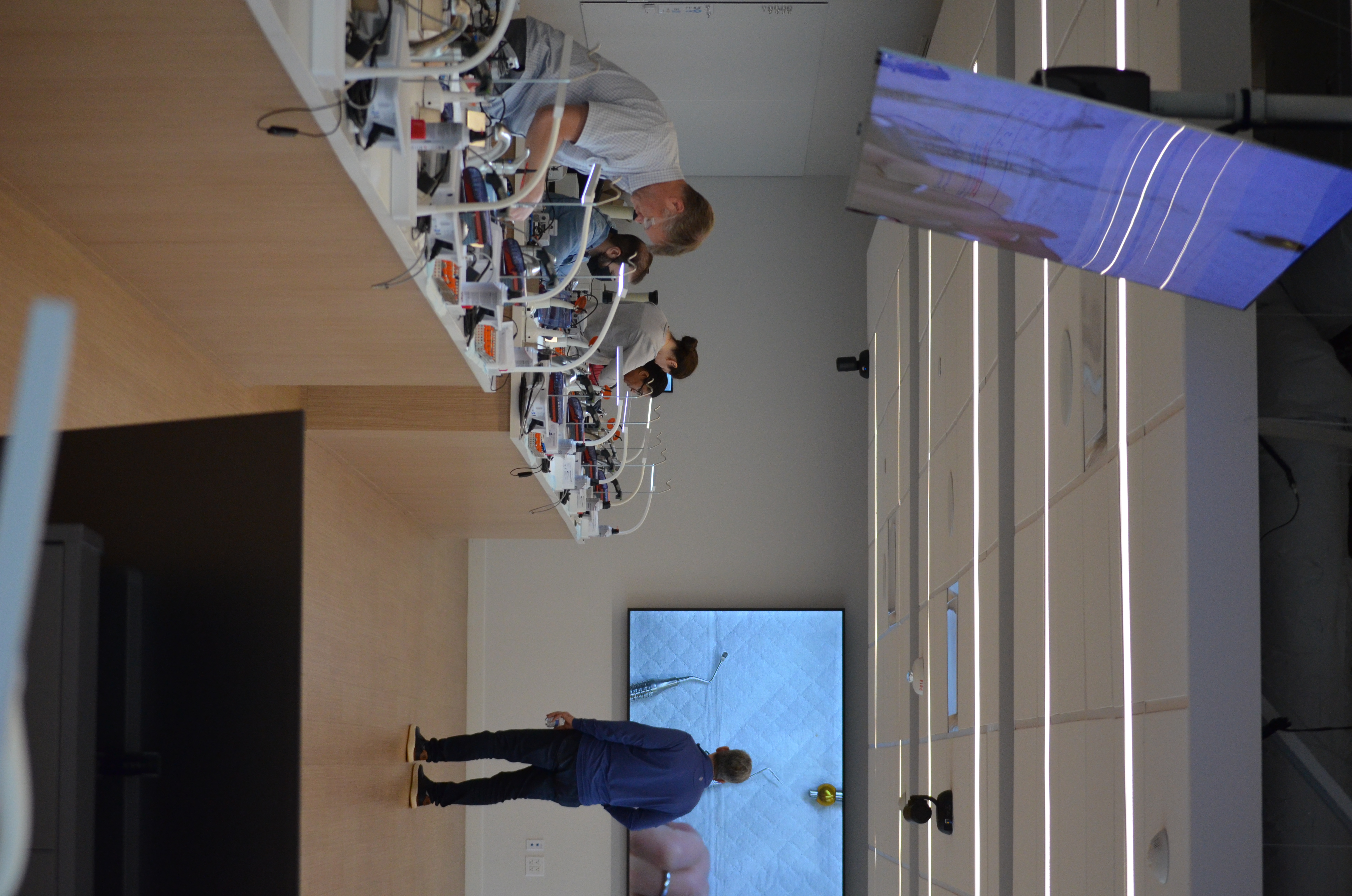 Dr. Faraj teaching implant techniques to other dentists