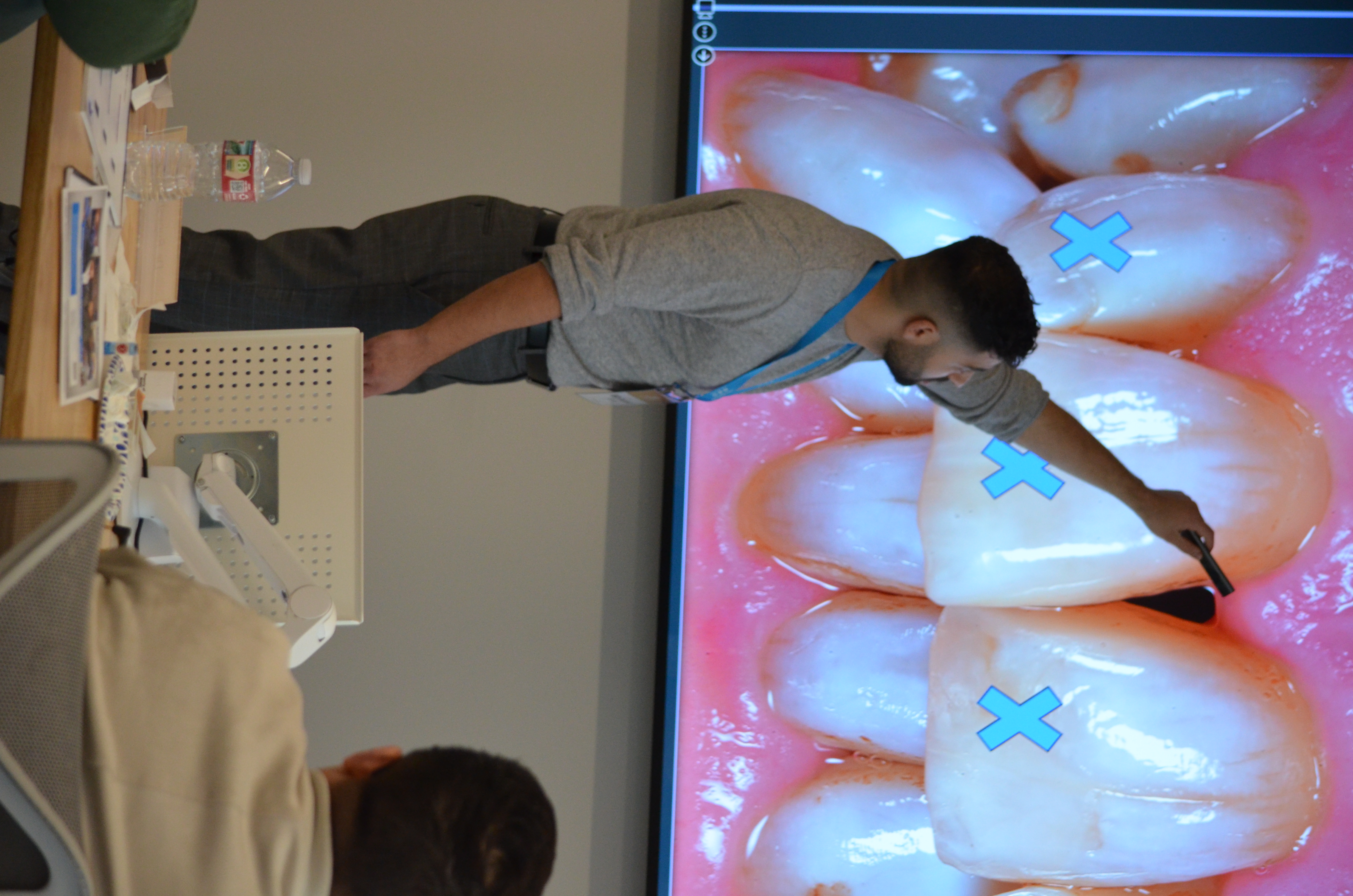 Dr. Faraj teaching implant techniques to other dentists