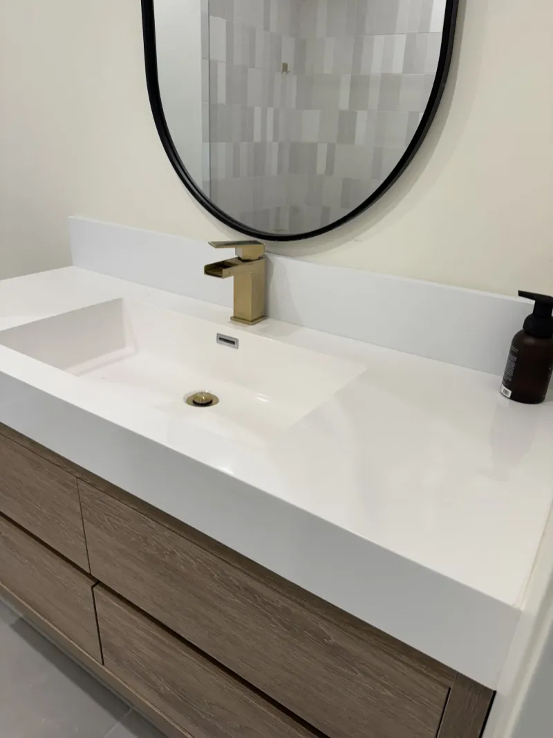 Floating wood-grain bathroom vanity with a one-piece white top