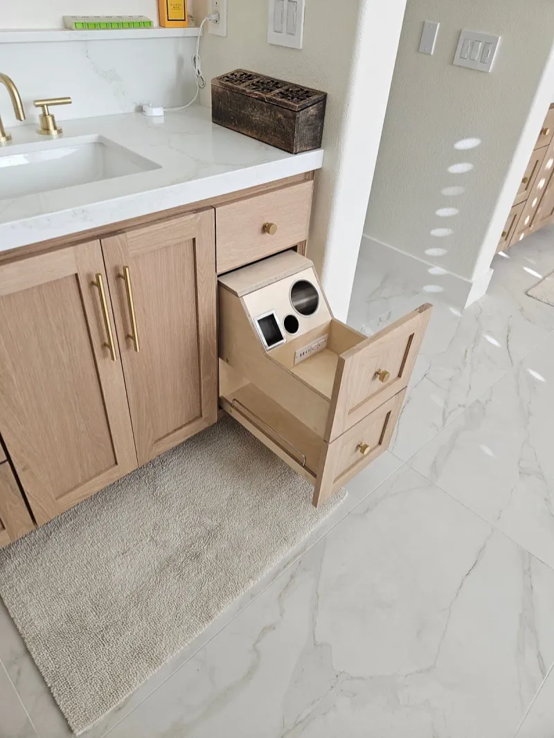 Oak vanity with a pull-out grooming drawer with built-in outlets