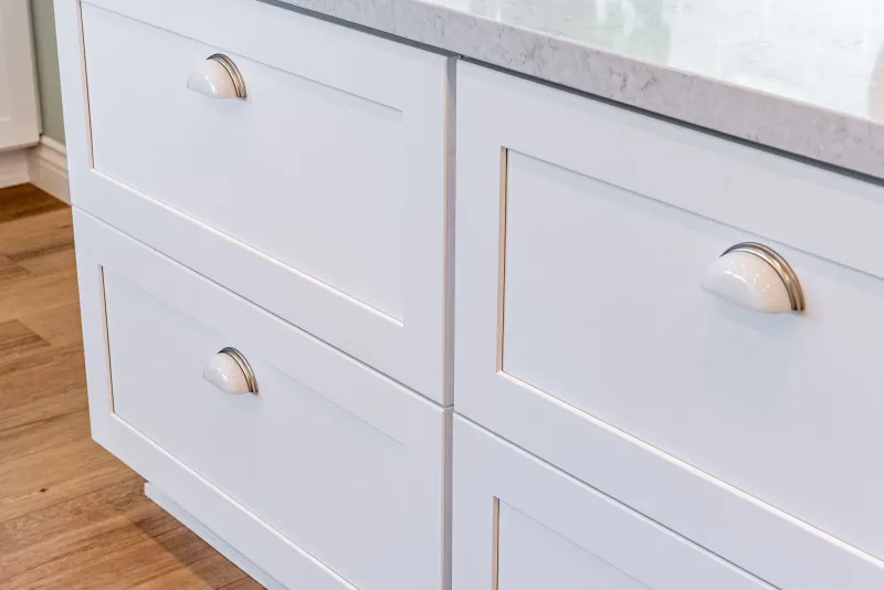 Close-up of white shaker drawer fronts and pulls