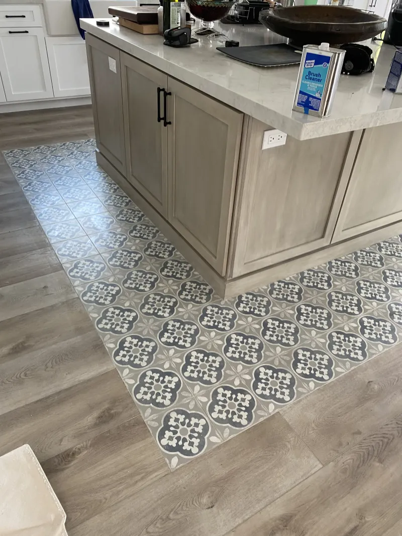 Weathered-oak island over a patterned tile floor