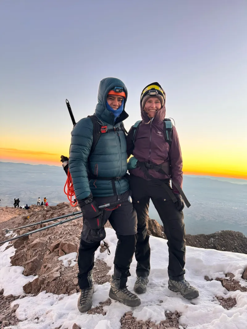 Climber and guide on the summit of La Malinche