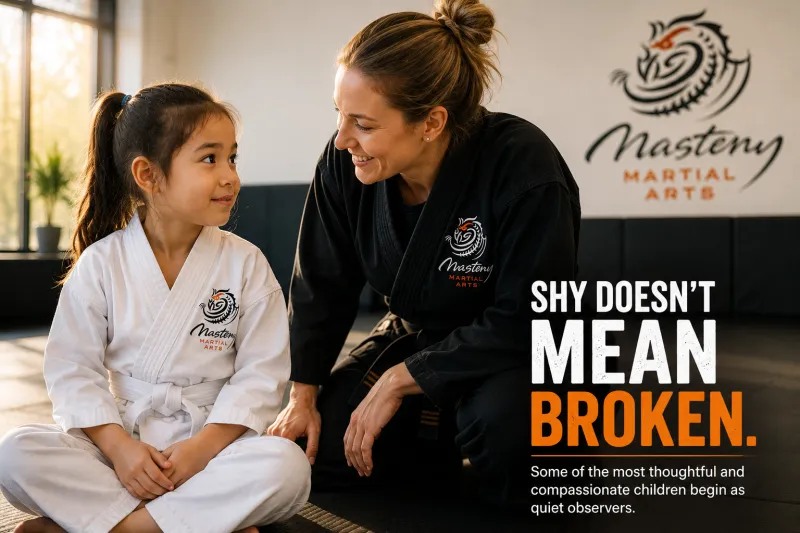 Young girl talking with a caring martial arts instructor who encourages her confidence and self-belief.