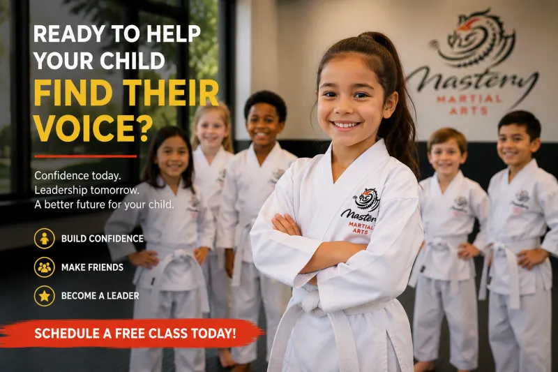 Confident young girl in a white Mastery Martial Arts uniform smiling proudly while standing in front of classmates after developing confidence, leadership skills, and finding her voice. Confident young girl in a white Mastery Martial Arts uniform smiling proudly while standing in front of classmates after developing confidence, leadership skills, and finding her voice.