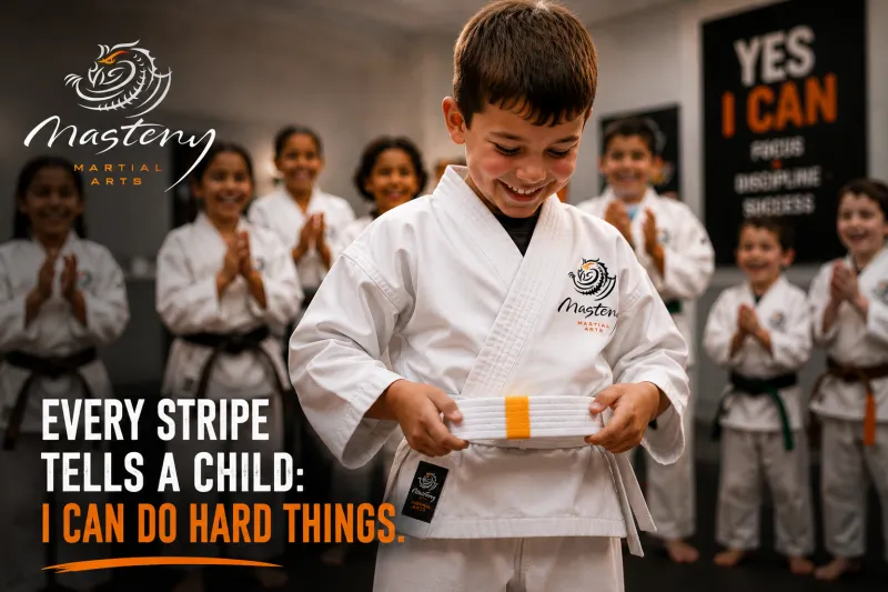 Young Mastery Martial Arts student proudly earning a stripe while building confidence through consistent effort. Young Mastery Martial Arts student proudly earning a stripe while building confidence through consistent effort.