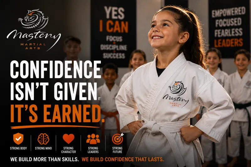 Confident Mastery Martial Arts student standing proudly after earning confidence through hard work and perseverance. Confident Mastery Martial Arts student standing proudly after earning confidence through hard work and perseverance.