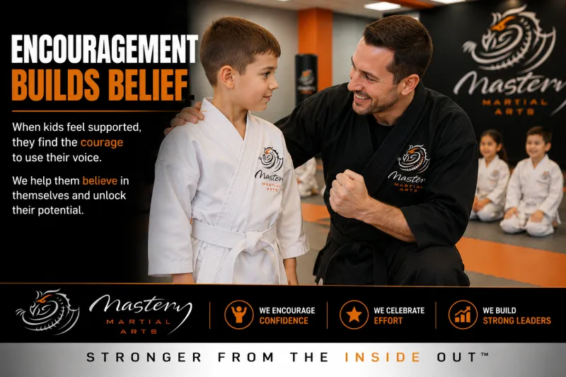 supportive instructor encouraging child during martial arts training at Mastery Martial Arts supportive instructor encouraging child during martial arts training at Mastery Martial Arts
