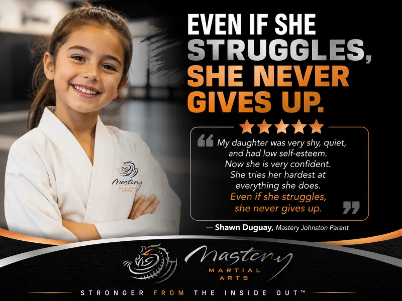 A confident Mastery Martial Arts student encouraging another child during class and demonstrating perseverance and leadership.
