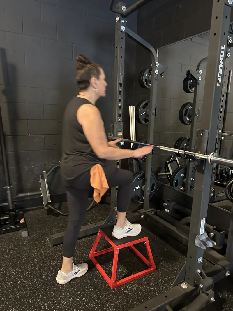 Client doing a step-up onto a box