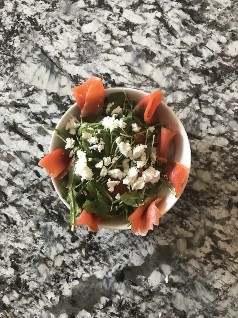 Salmon and greens salad plated by Chef Zander