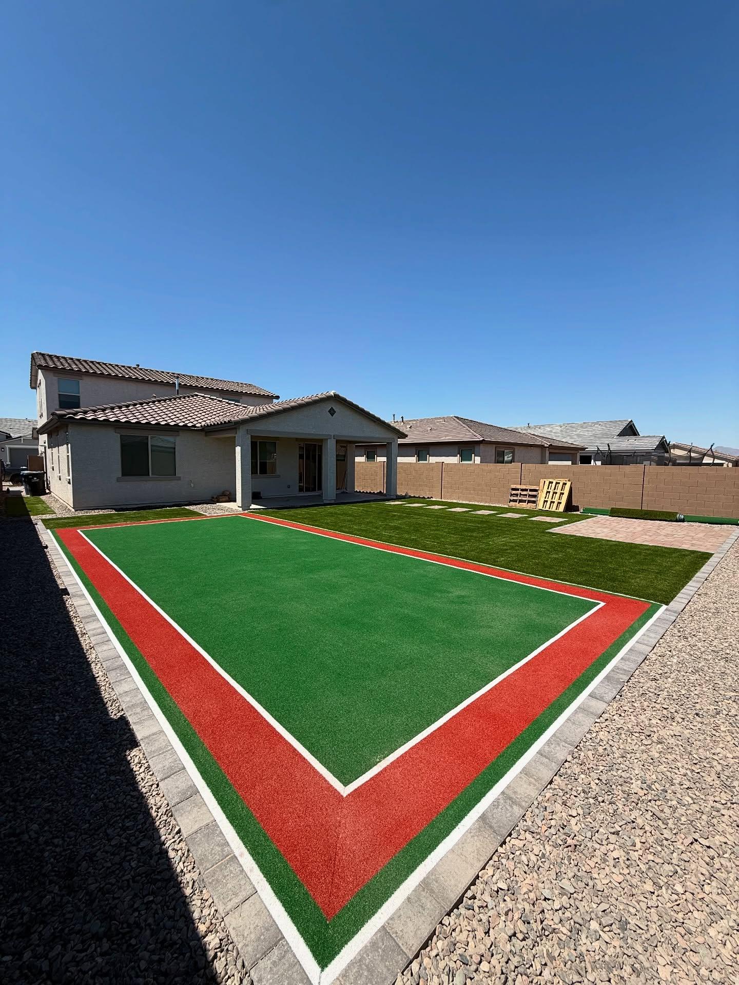 Custom multi-color sports turf game court with paver and gravel border