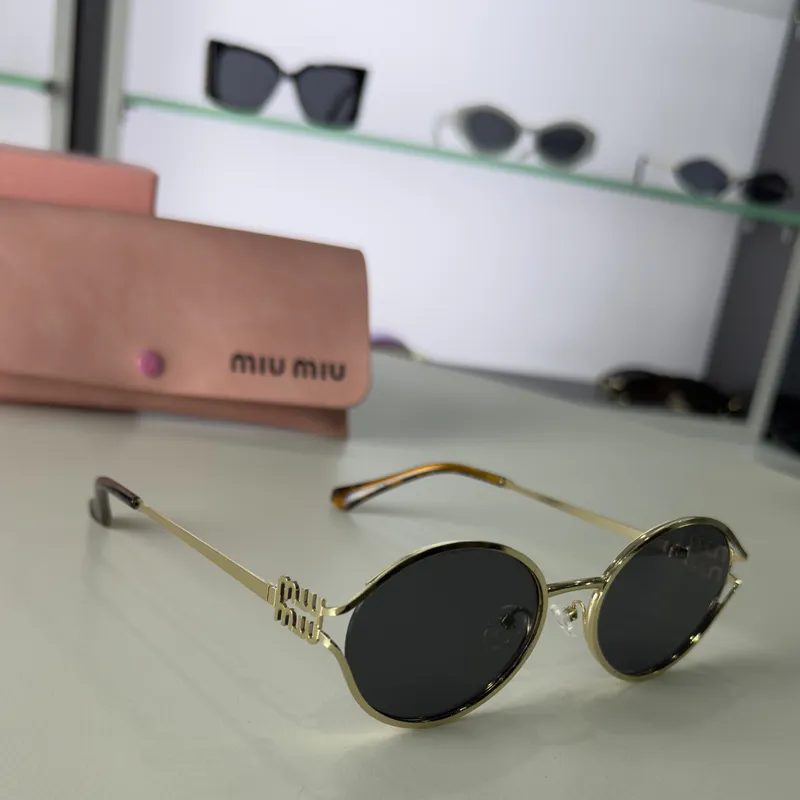 Miu Miu - Metal Frame Oval Black Lenses 