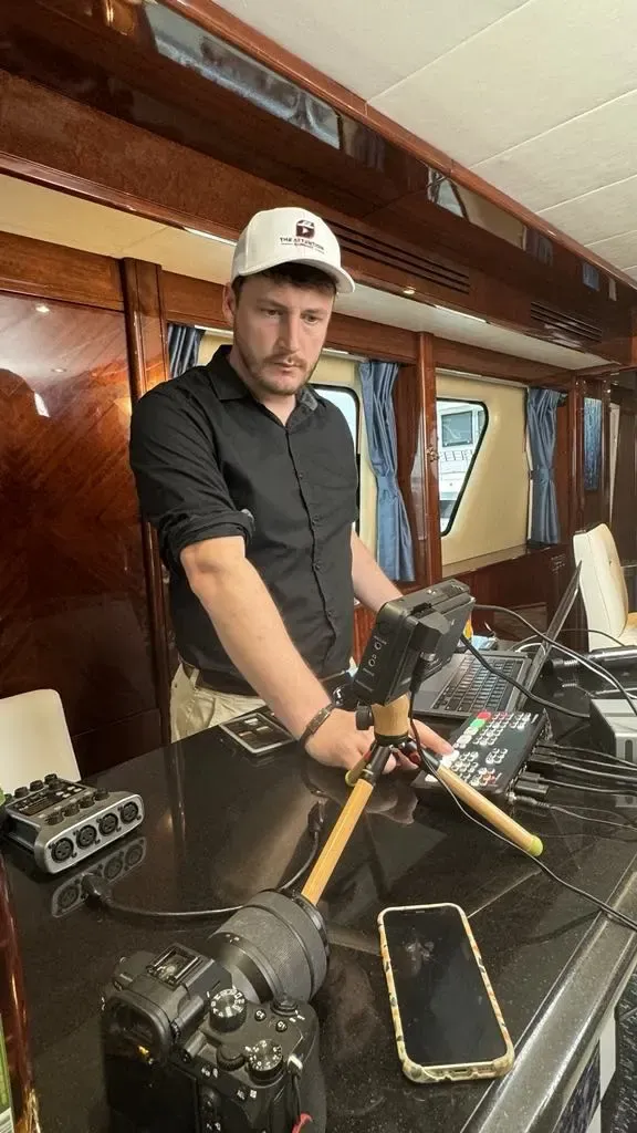 Fitz setting up a camera rig on location