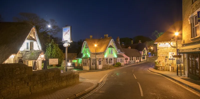 Shanklin Old Village with thatched cottages and twinkling lights in winter