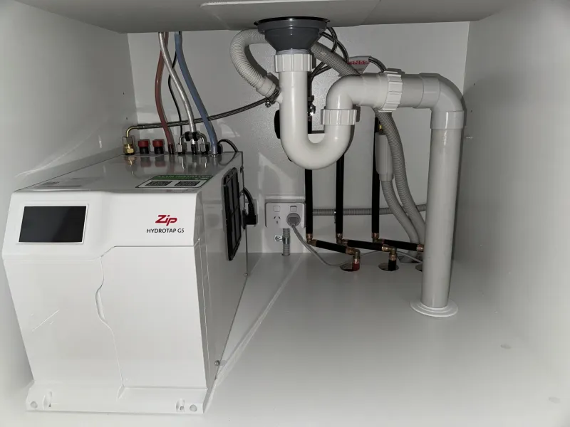 Filtered water unit and pipework installed under a sink