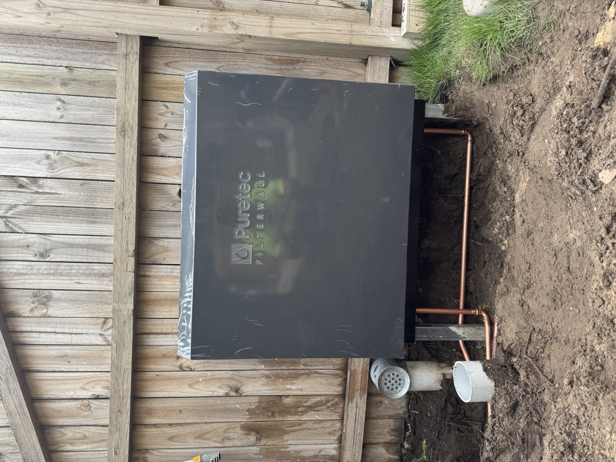 Puretec Filterwall cabinet installed outdoors with copper pipework