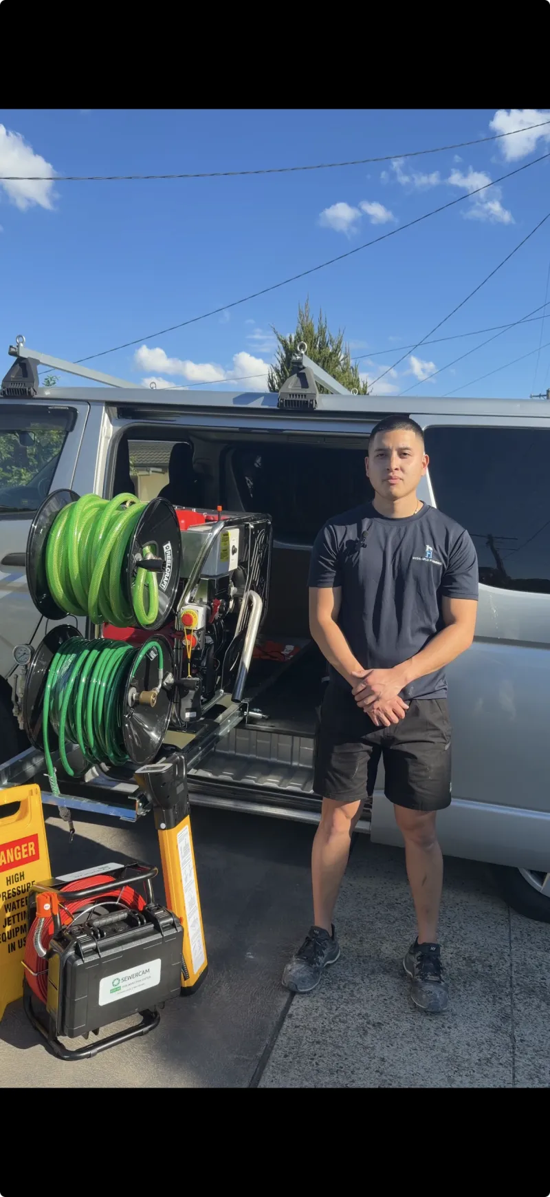 High pressure water jetting rig with two hose reels loaded in the back of a work van
