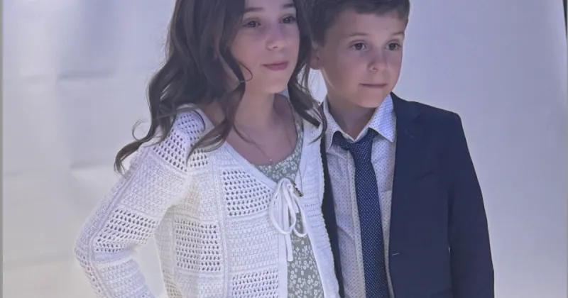 two kids taking picture together