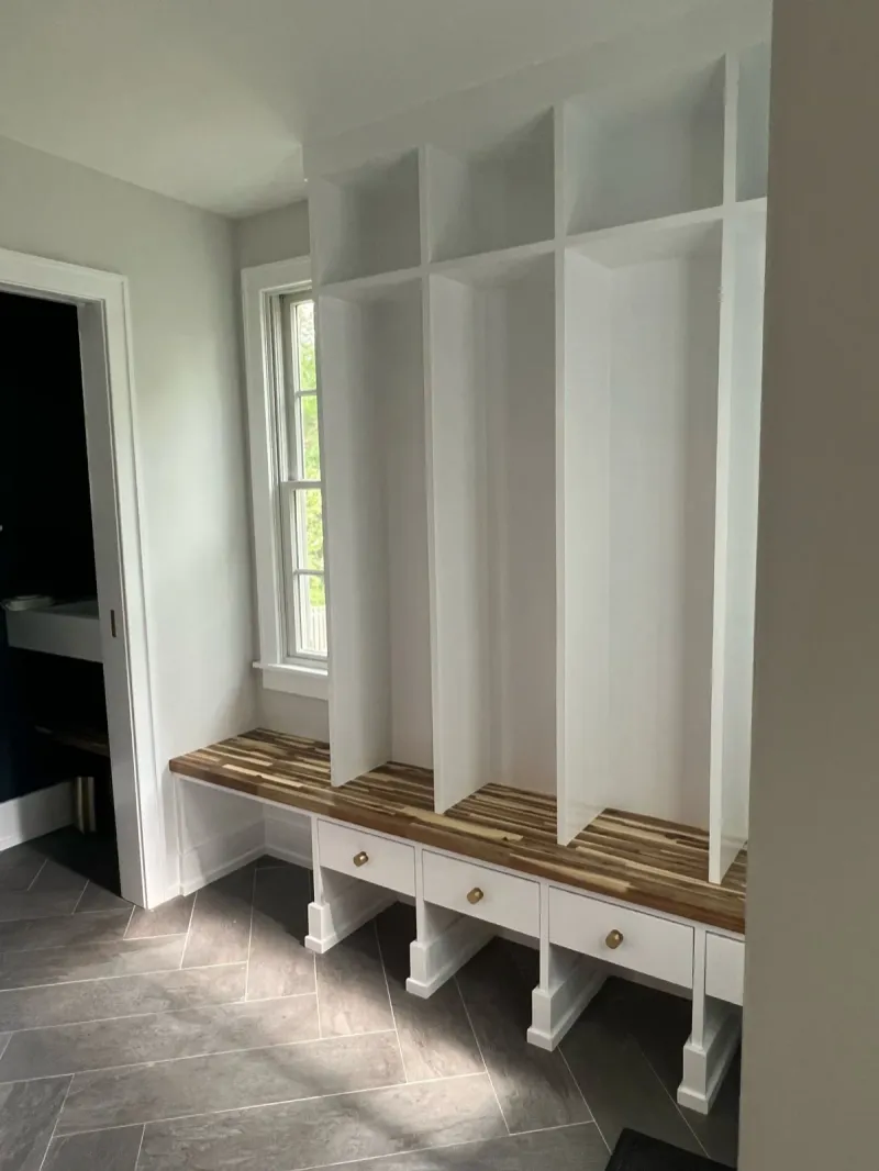 Custom mudroom built-in lockers with bench and drawers