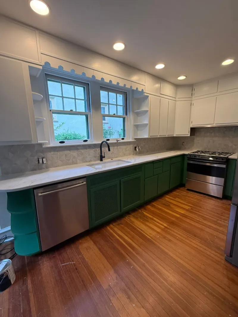 Kitchen after cabinet painting: white uppers and green lowers