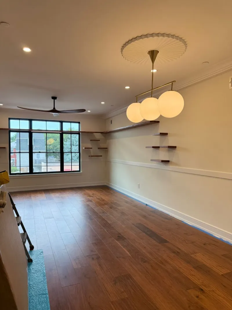 Finished hardwood floor in a freshly painted living room