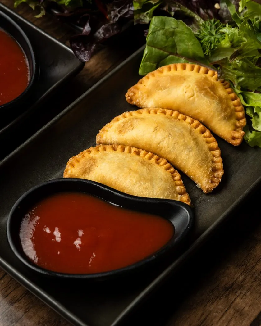 Golden Sri Lankan patties with chilli dipping sauce