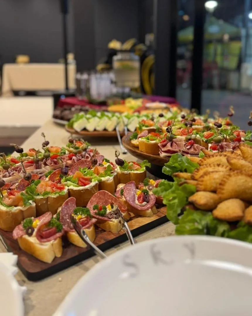 Canapés and pastries laid out on a catering table
