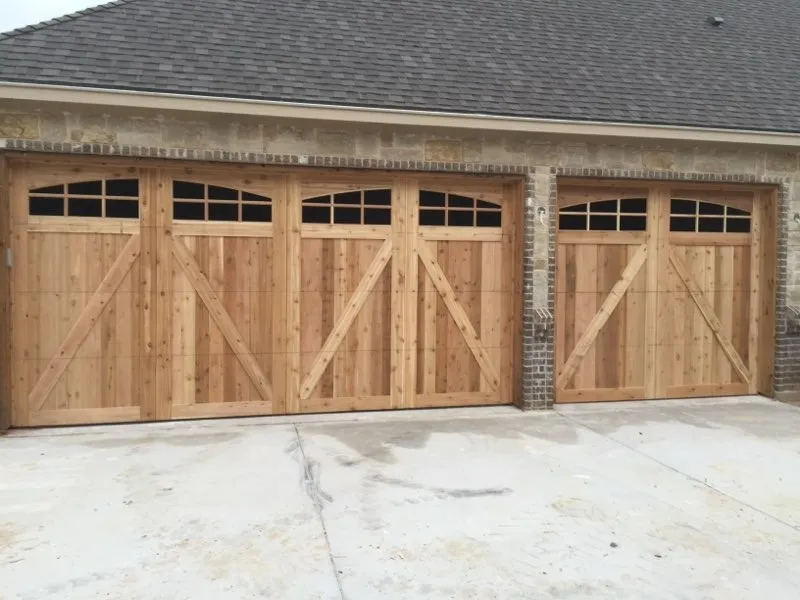 Cedar double and single garage doors with window tops