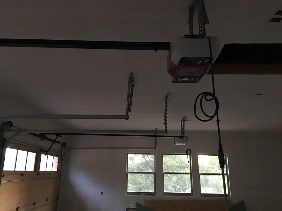Garage door opener and door installed together