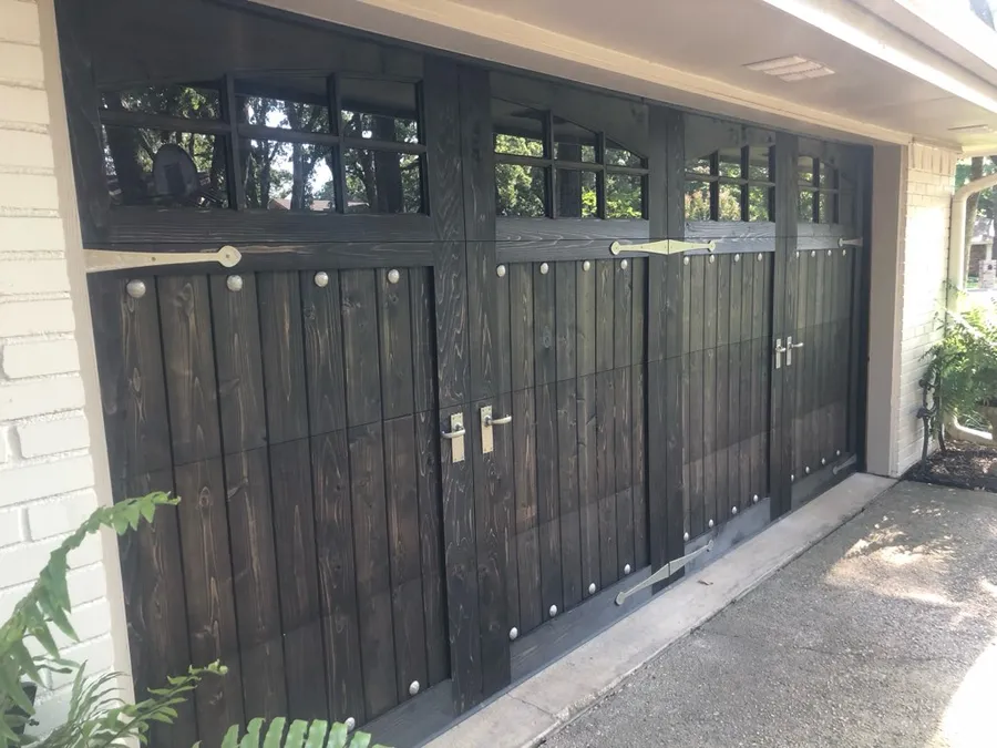Dark stained cedar carriage-style garage doors