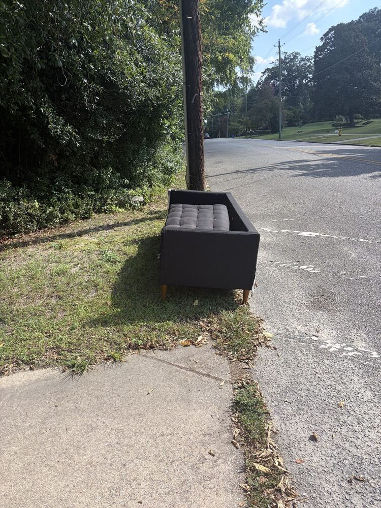 Couch curbside before pickup in Fayetteville