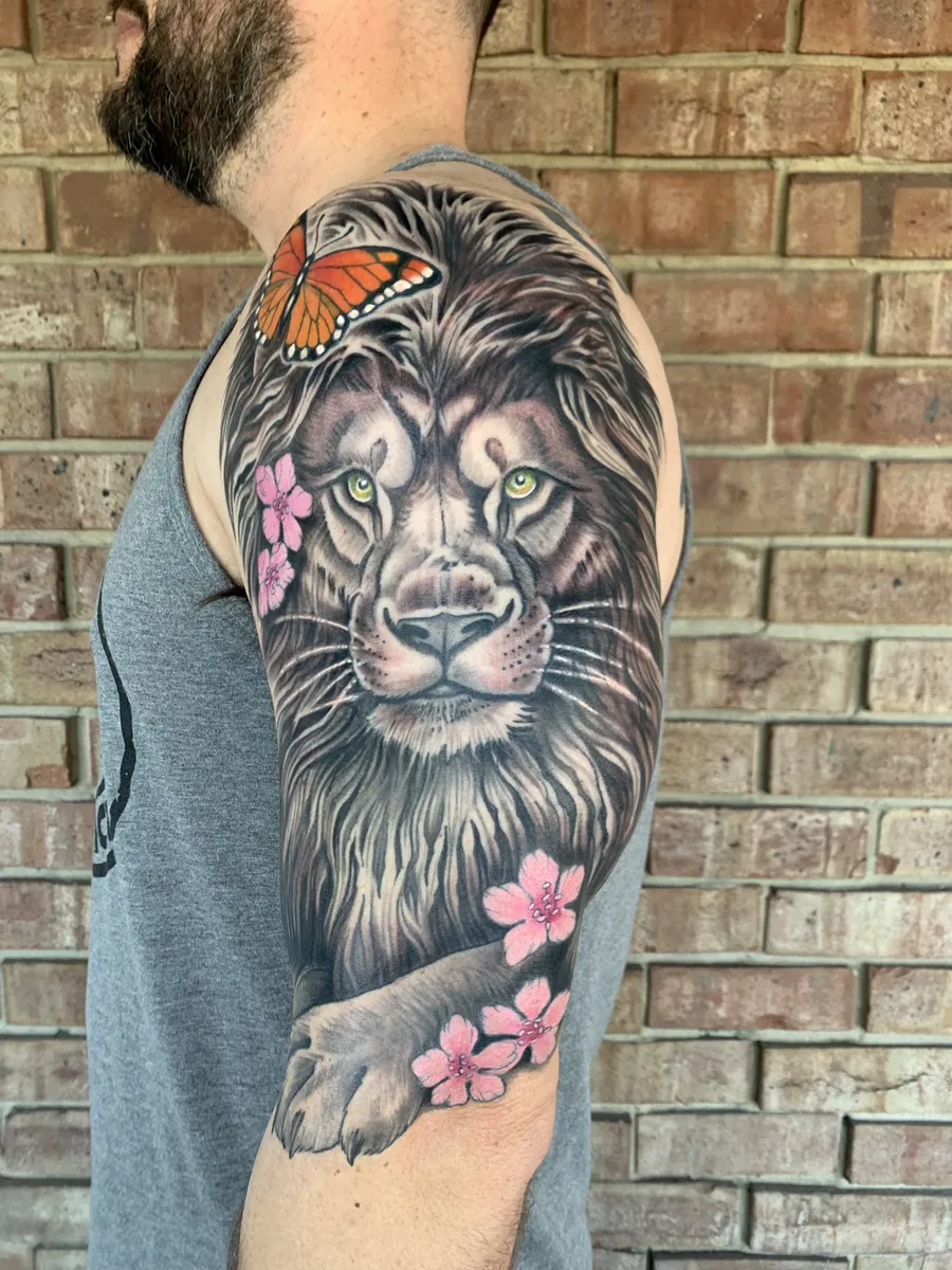Lion and cherry blossom tattoo by Nicole J. Miller