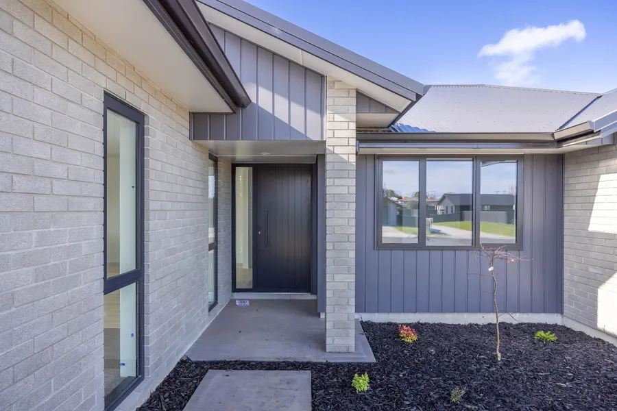 Front entry with grey brick and vertical weatherboard, Lot 11 Thorncombe Park, Te Awamutu