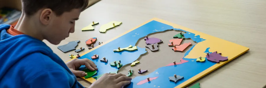 A learner working on a map puzzle