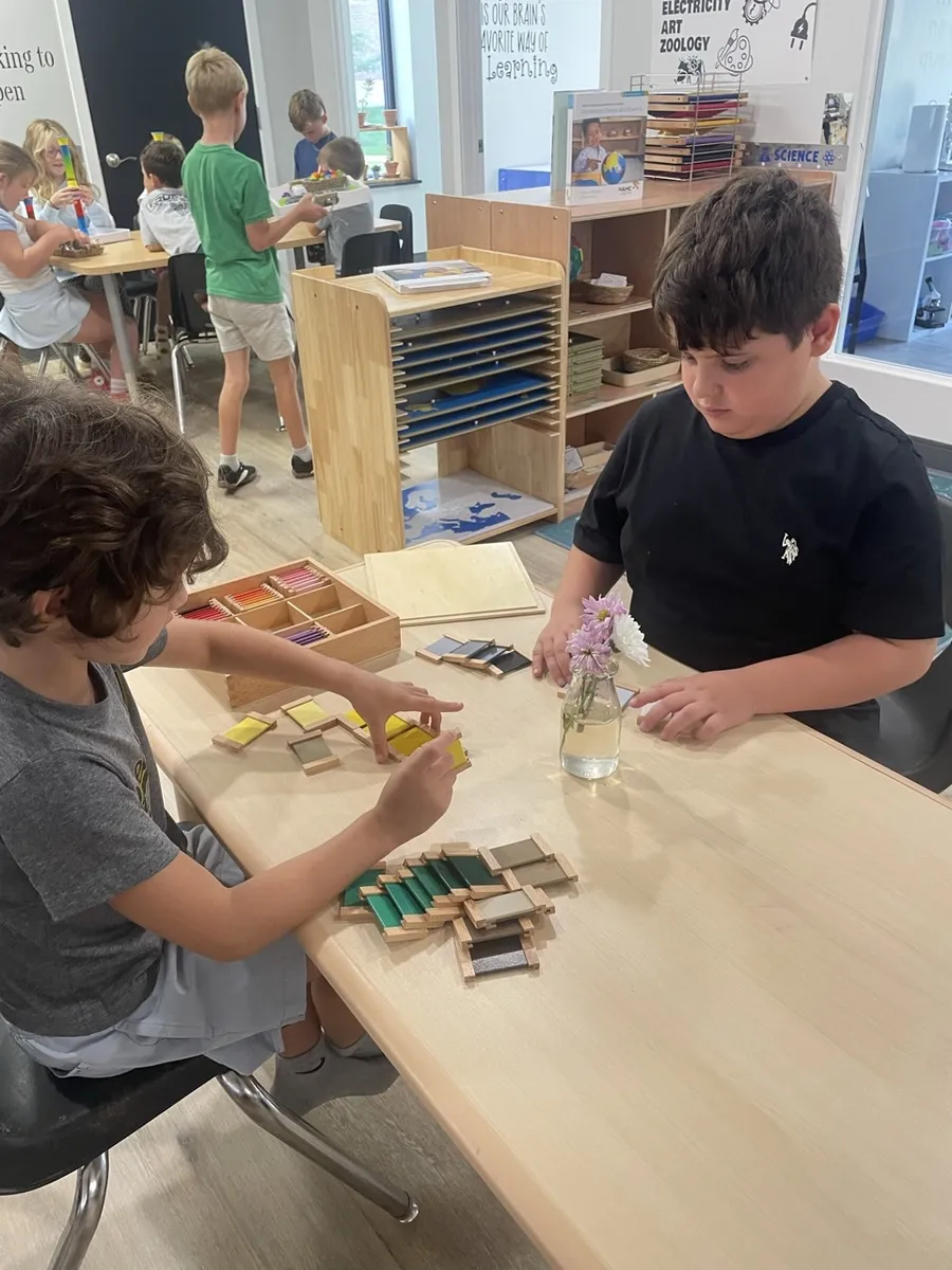 Spark learners working with materials at a table