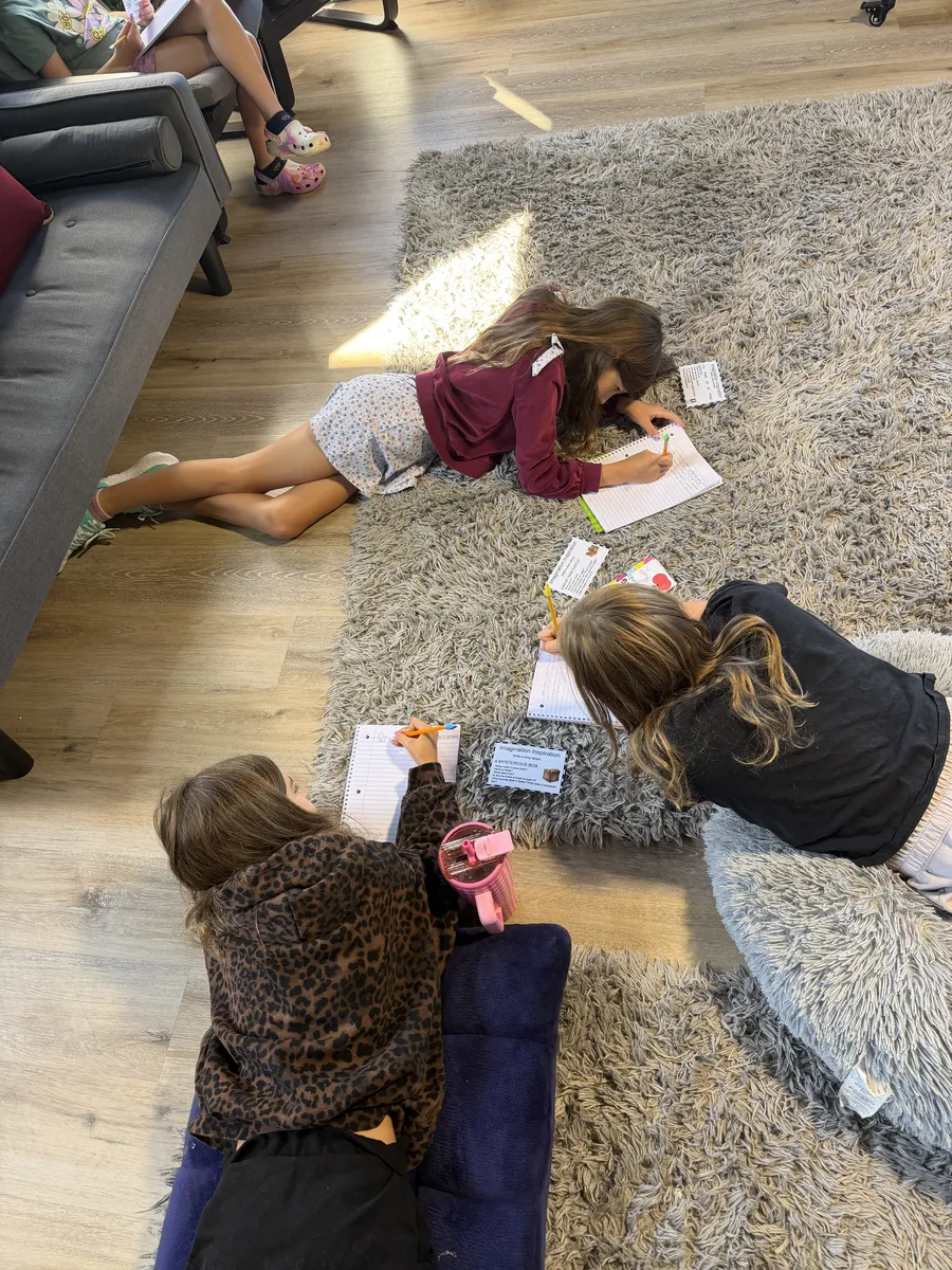 Learners playing together on the floor